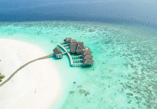 Stilt houses in the turquoise Maldive sea